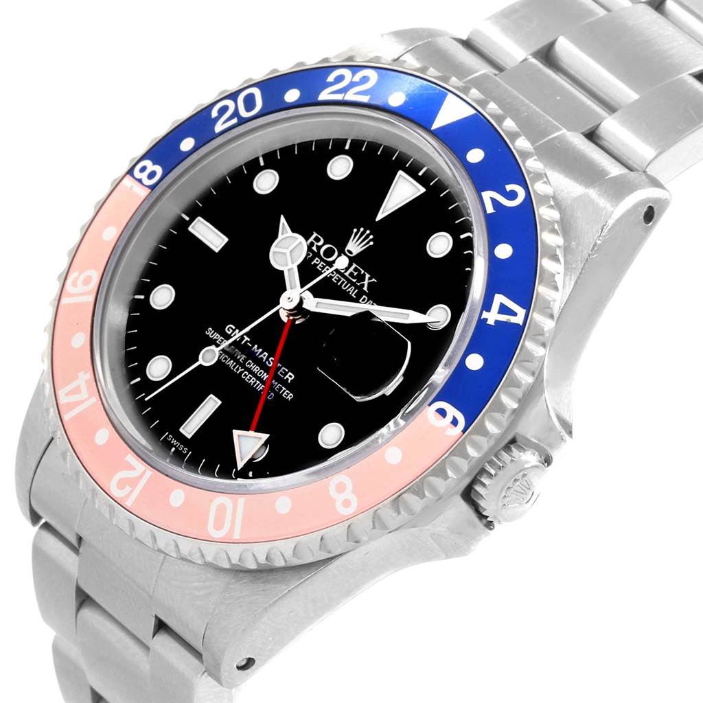 This image shows a close-up of the face, bezel, and part of the bracelet of a Rolex GMT-Master 16700 Men's Stainless Steel Black Dial 16700 Men's Stainless Steel Black Dial watch.