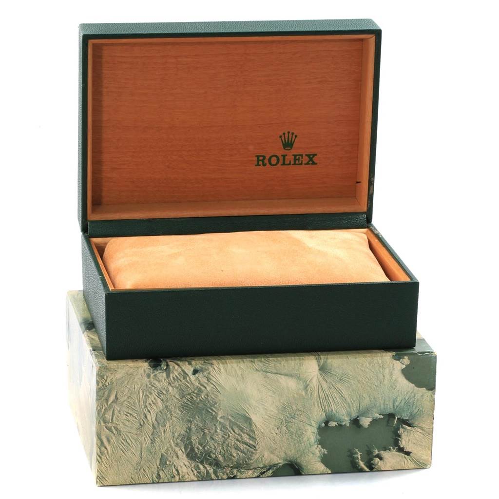 This image shows an opened Rolex GMT-Master 16700 Men's Stainless Steel Black Dial 16700 Men's Stainless Steel Black Dial watch box with a green outer box and a cushioned interior.