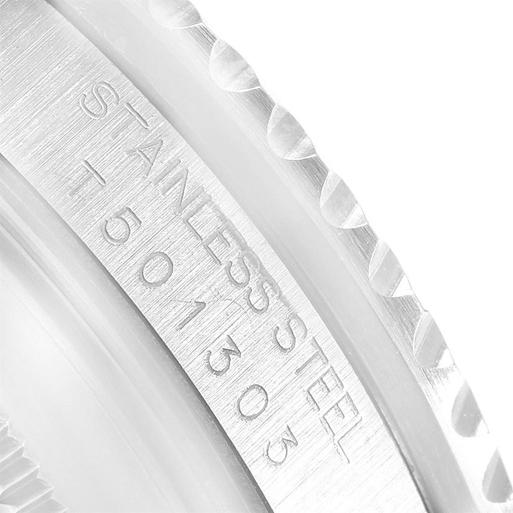This image shows a close-up of the etched serial number and stainless steel designation on the side of a Rolex GMT-Master 16710 Men's Stainless Steel Black Dial 16710 Men's Stainless Steel Black Dial watch case.