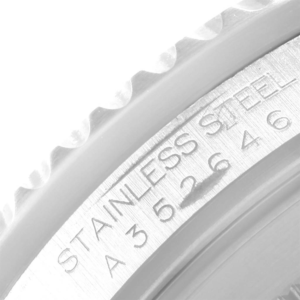 The image shows a close-up of the side and partially the engraved bezel of the Rolex GMT-Master 16710 Men's Stainless Steel Black Dial 16710 Men's Stainless Steel Black Dial watch, highlighting its stainless steel composition.