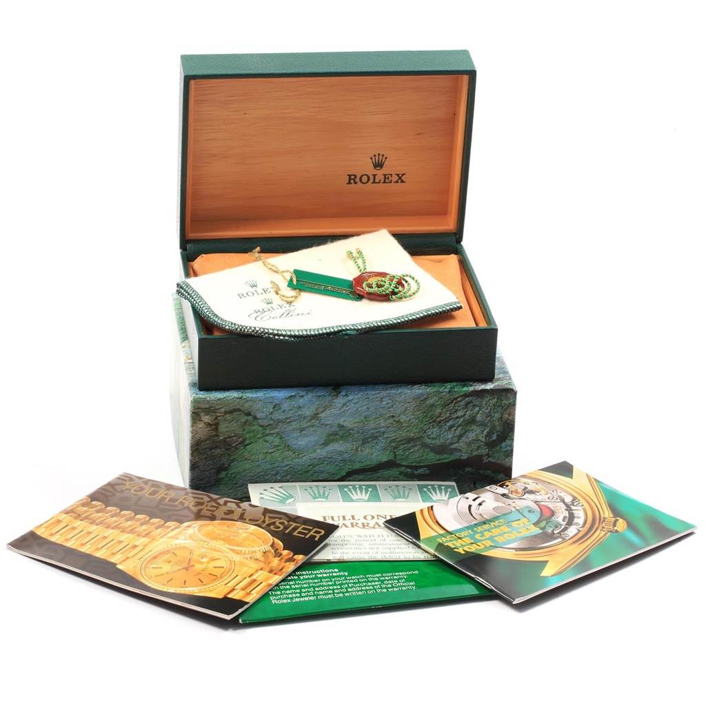 The image shows the packaging, accessories, and manuals for the Rolex GMT-Master 16710 Men's Stainless Steel Black Dial 16710 Men's Stainless Steel Black Dial, including tags, a cloth, and a warranty card.