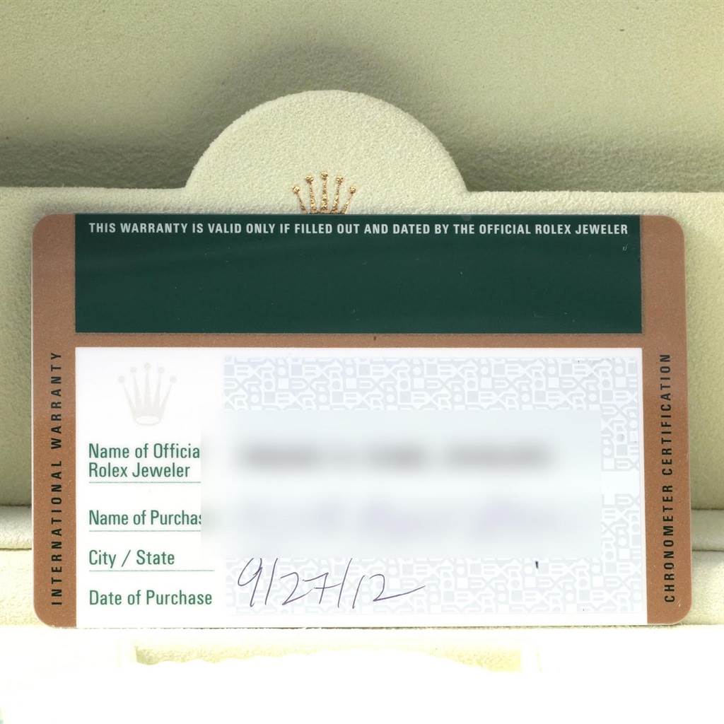 The image shows an international warranty card for a Rolex GMT-Master 116710 Men
s Stainless Steel Black Dial 116710 Men
s Stainless Steel Black Dial watch, placed inside a watch box.