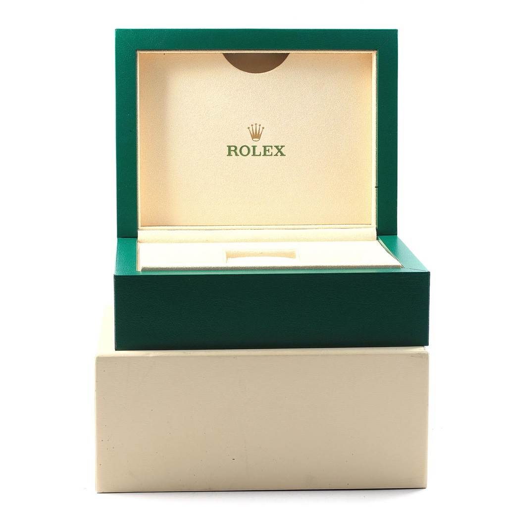 The image shows an open green and beige Rolex box for the GMT-Master model, highlighting the interior compartment.
