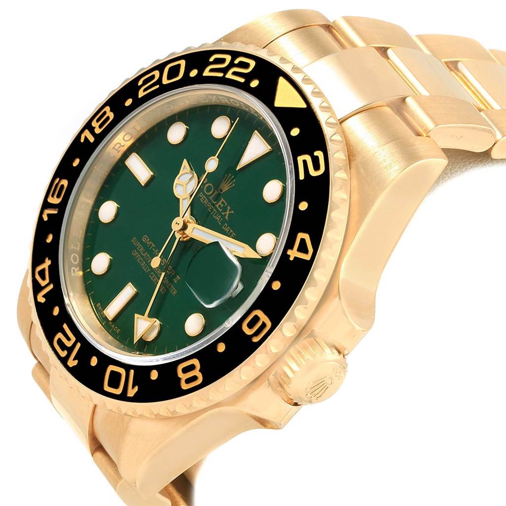 This image shows a side angle of the Rolex GMT-Master 116718 Men's Yellow Gold Green Dial 116718 Men's Yellow Gold Green Dial watch, highlighting its green dial and gold case.