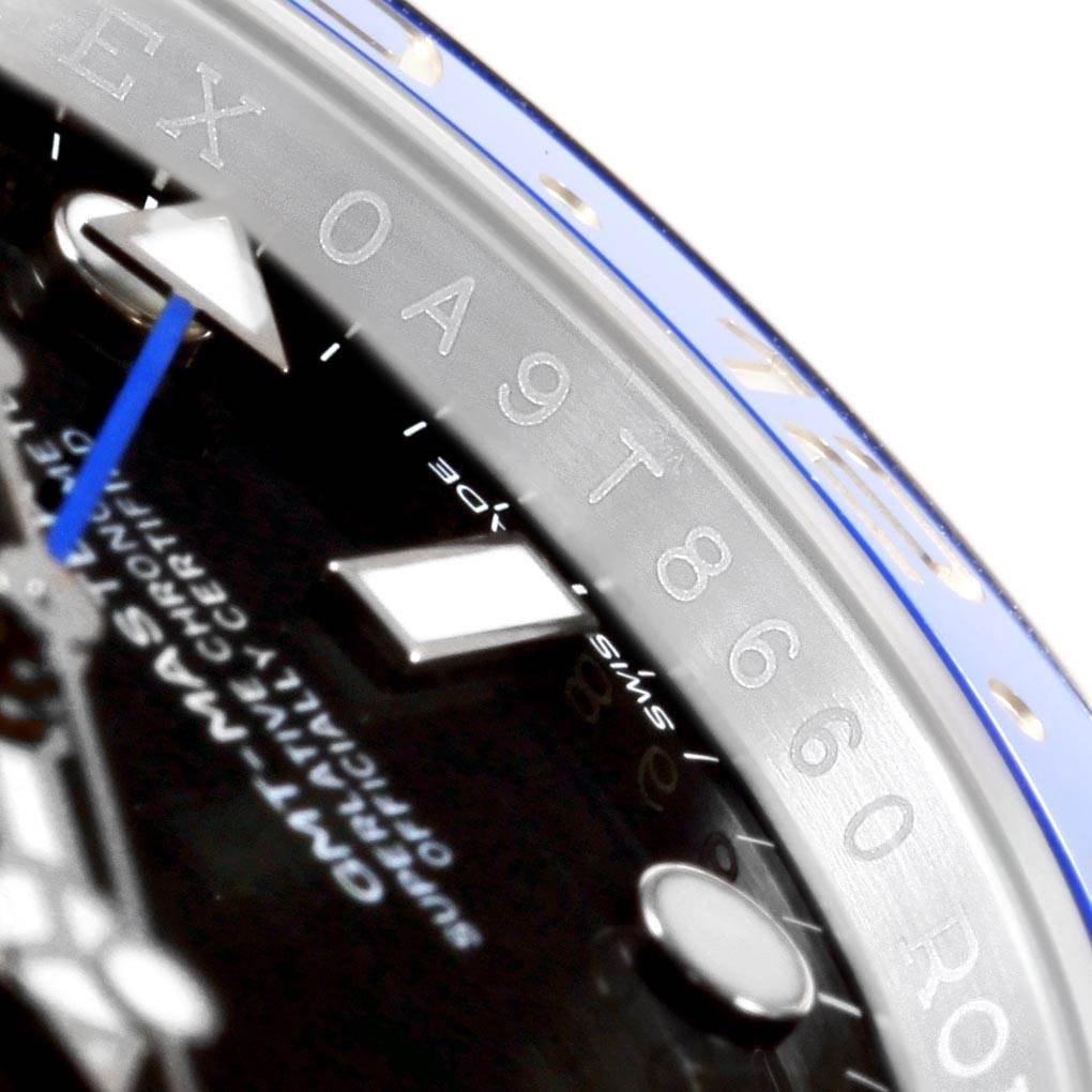 Close-up of the Rolex GMT-Master 116710 Men's Stainless Steel Black Dial 116710 Men's Stainless Steel Black Dial watch showing part of the dial, minute marker, and bezel.