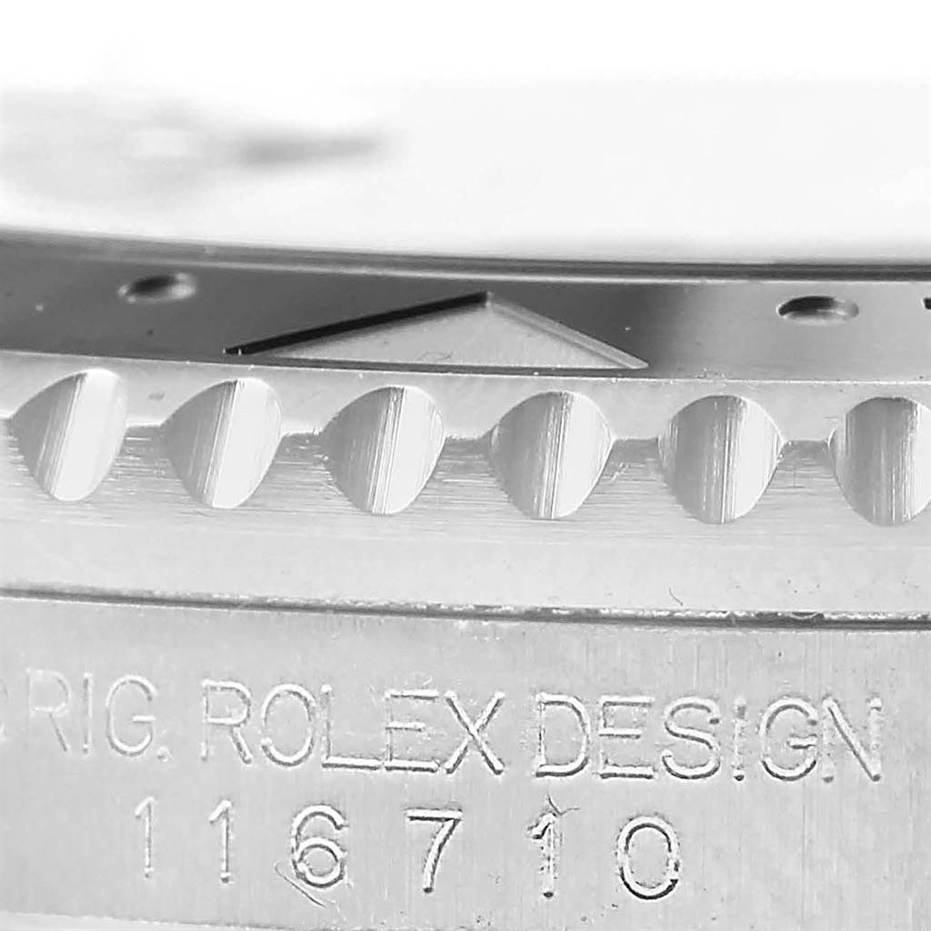 The image shows a close-up of the bezel and case side of a Rolex GMT-Master 116710 Men's Stainless Steel Black Dial 116710 Men's Stainless Steel Black Dial model, with the model number engraved.