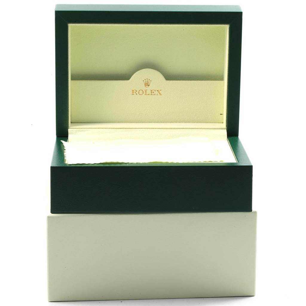 This image shows the open green and beige box of a Rolex GMT-Master 116710 Men's Stainless Steel Black Dial 116710 Men's Stainless Steel Black Dial watch, with the lid raised and the interior visible.