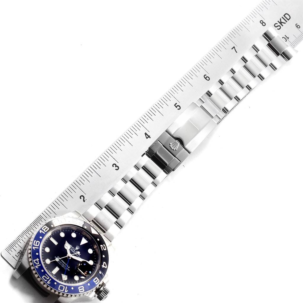 The image shows a Rolex GMT-Master 116710 Men's Stainless Steel Black Dial 116710 Men's Stainless Steel Black Dial watch laid flat with a ruler for size reference, displaying the stainless steel bracelet and bezel.