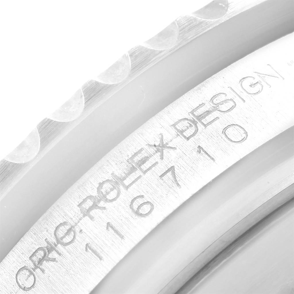 The image shows a close-up view of the rehaut of a Rolex GMT-Master 116710 Men's Stainless Steel Black Dial 116710 Men's Stainless Steel Black Dial watch, including the engraved model number.