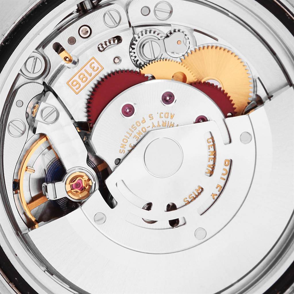 This close-up image of a Rolex GMT-Master 116710 Men's Stainless Steel Black Dial 116710 Men's Stainless Steel Black Dial watch shows the intricate details of its internal movement and gears.