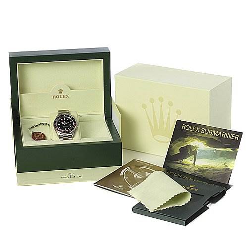 The image shows a Rolex GMT-Master 16710 Men's Stainless Steel Black Dial 16710 Men's Stainless Steel Black Dial watch from a front angle, along with its green box, outer box, manuals, and a polishing cloth.