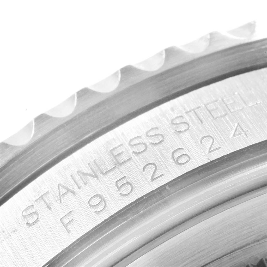 This close-up image of the Rolex GMT-Master 16710 Men
s Stainless Steel Black Dial 16710 Men
s Stainless Steel Black Dial watch shows the engraved stainless steel case and part of the serrated bezel.