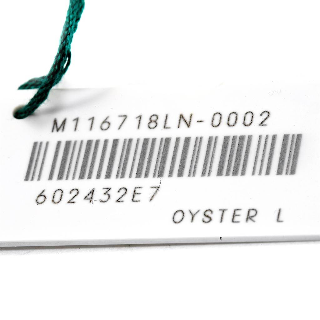 The image shows a tag for a Rolex GMT-Master 116718LN Men's Yellow Gold Green Dial 116718LN Men's Yellow Gold Green Dial model with a barcode and reference number "M116718LN-0002".