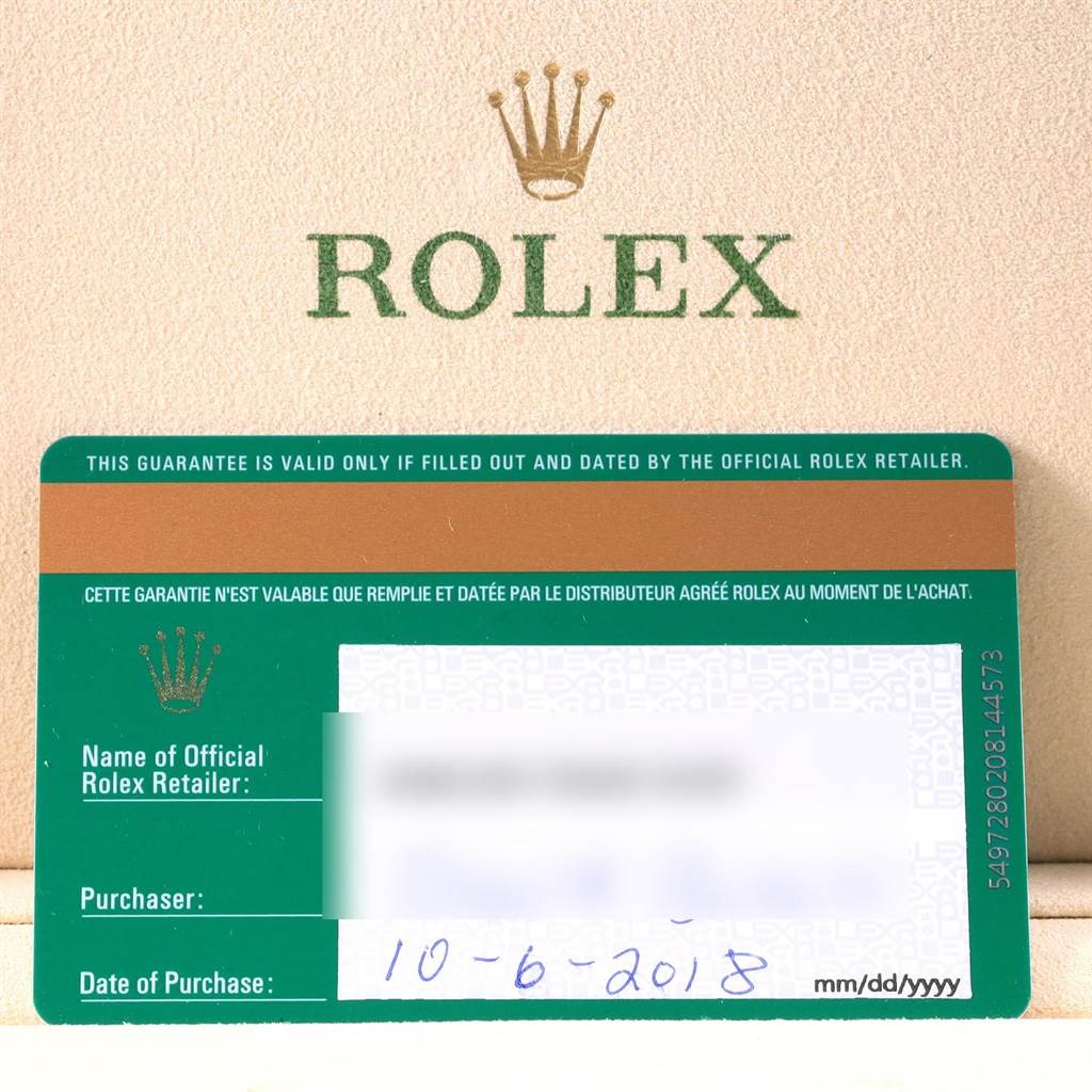 The image shows the warranty card of a Rolex GMT-Master 116718LN Men's Yellow Gold Green Dial 116718LN Men's Yellow Gold Green Dial, with the brand's logo in the background.