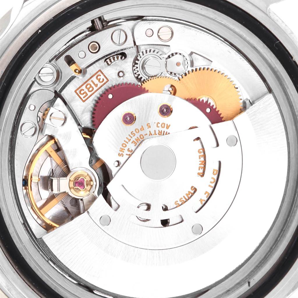 This image shows the internal mechanism of the Rolex GMT-Master 16710 Men's Stainless Steel Black Dial 16710 Men's Stainless Steel Black Dial watch, highlighting gears, screws, and the rotor at a close-up angle.
