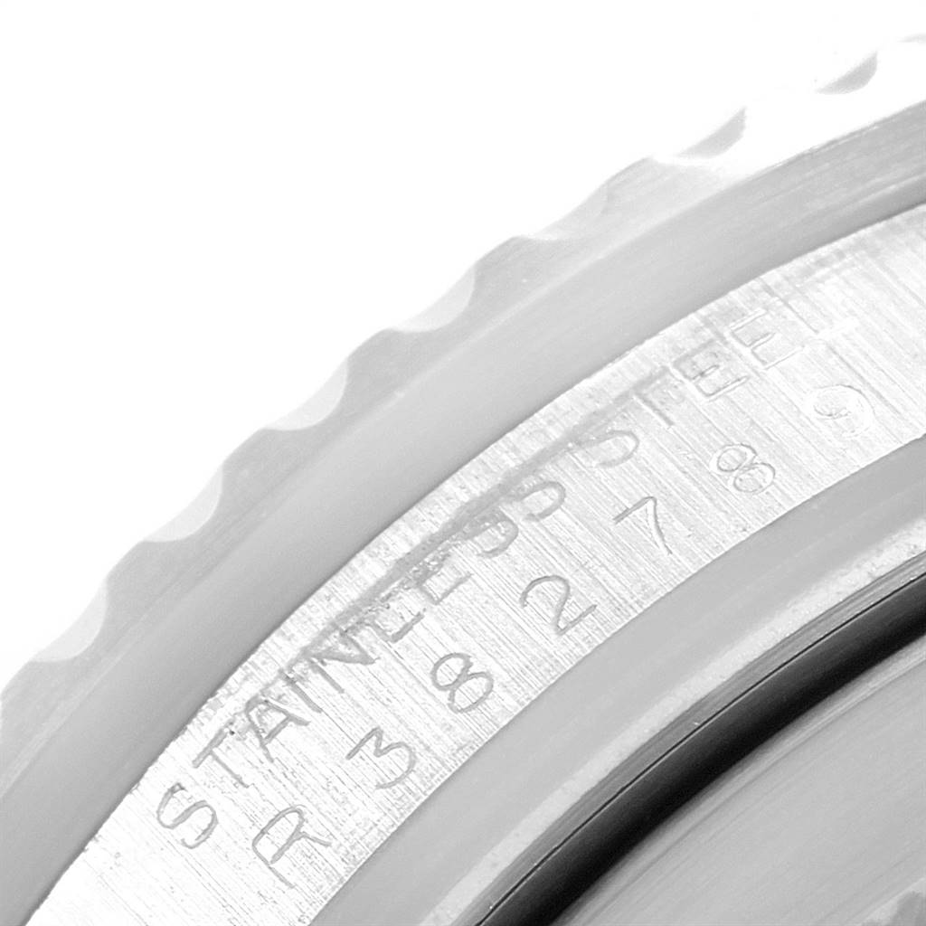 The image shows a close-up angle of the bezel and serial number engravings of a Rolex GMT-Master 16760 Men's Stainless Steel Black Dial 16760 Men's Stainless Steel Black Dial watch.