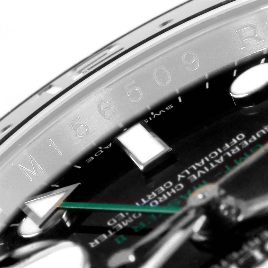 The image shows a close-up of the bezel, dial, and one hand of the Rolex GMT-Master 116710 Men's Stainless Steel Black Dial 116710 Men's Stainless Steel Black Dial watch.