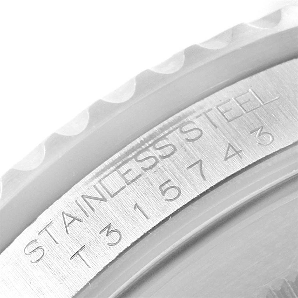 This image shows a close-up of the case and bezel of a Rolex GMT-Master 16700 Men's Stainless Steel Black Dial 16700 Men's Stainless Steel Black Dial, highlighting the stainless steel marking and serial number.