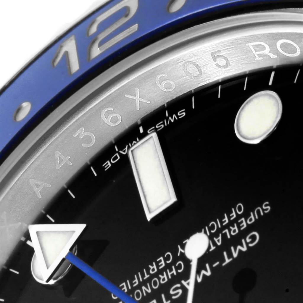 This close-up showcases the bezel, part of the dial, and hands of a Rolex GMT-Master 116710 Men's Stainless Steel Black Dial 116710 Men's Stainless Steel Black Dial watch.