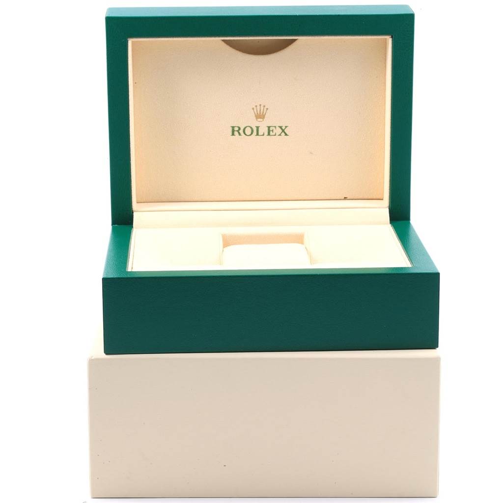 This image shows an open Rolex GMT-Master 116710 Men's Stainless Steel Black Dial 116710 Men's Stainless Steel Black Dial watch box with green exterior and beige interior.