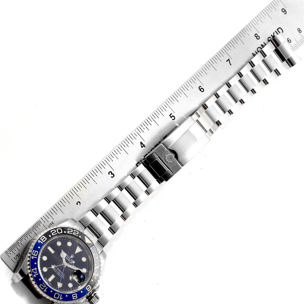 The image shows a Rolex GMT-Master 116710 Men's Stainless Steel Black Dial 116710 Men's Stainless Steel Black Dial watch laid flat alongside a ruler, displaying its bracelet and clasp.