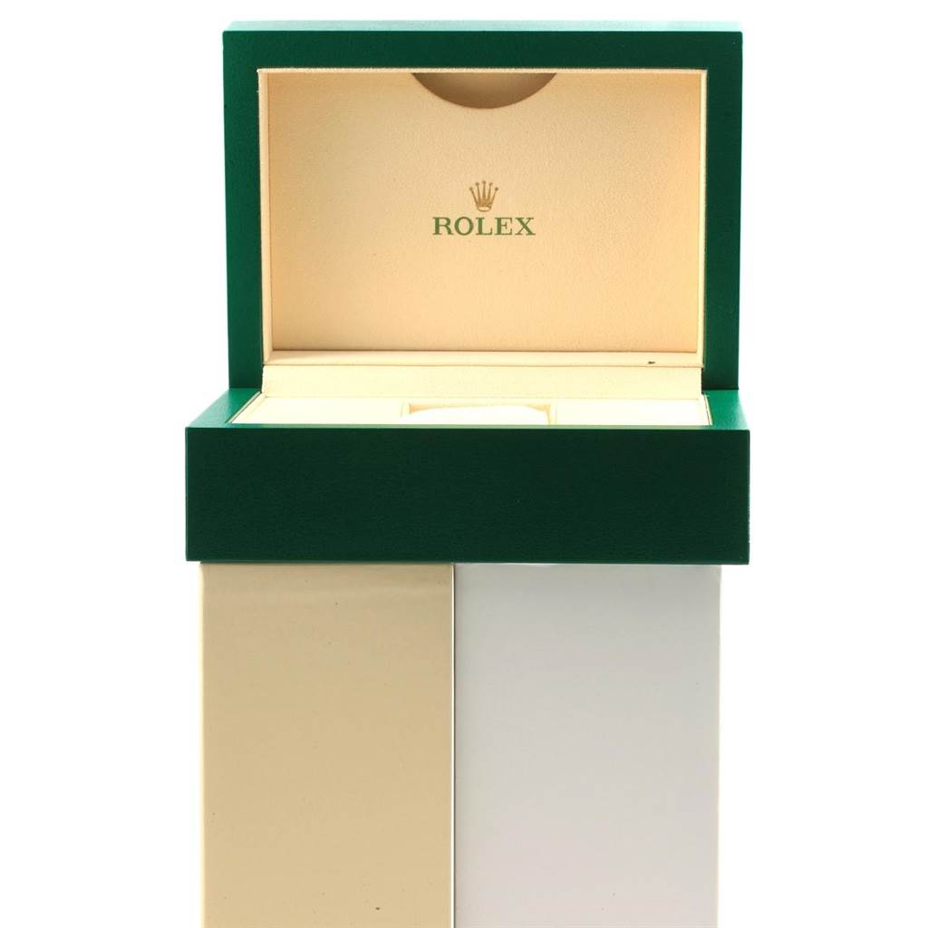 The image shows the open box of a Rolex GMT-Master 116710 Men's Stainless Steel Black Dial 116710 Men's Stainless Steel Black Dial watch, displaying its green exterior and beige interior.