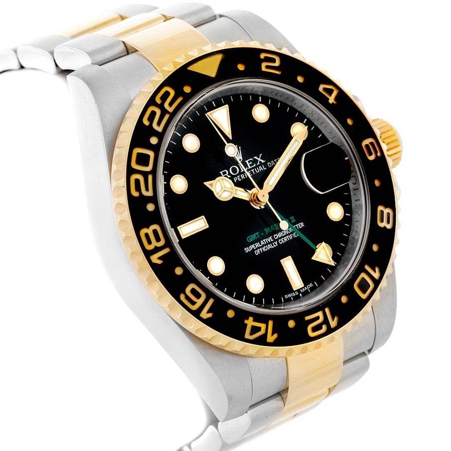 This image shows a side angle of the Rolex GMT-Master 116713 Men
s Stainless Steel Black Dial 116713 Men
s Stainless Steel Black Dial watch highlighting its bezel, dial, and part of the bracelet.