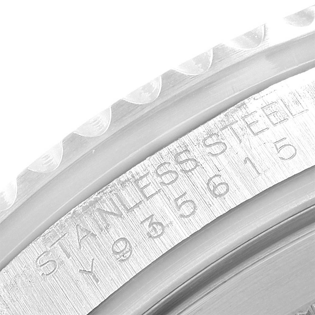 This close-up angle shows the side of the Rolex GMT-Master 20121 Men's Stainless Steel Black Dial 20121 Men's Stainless Steel Black Dial watch, focusing on its stainless steel engraving and serial number.