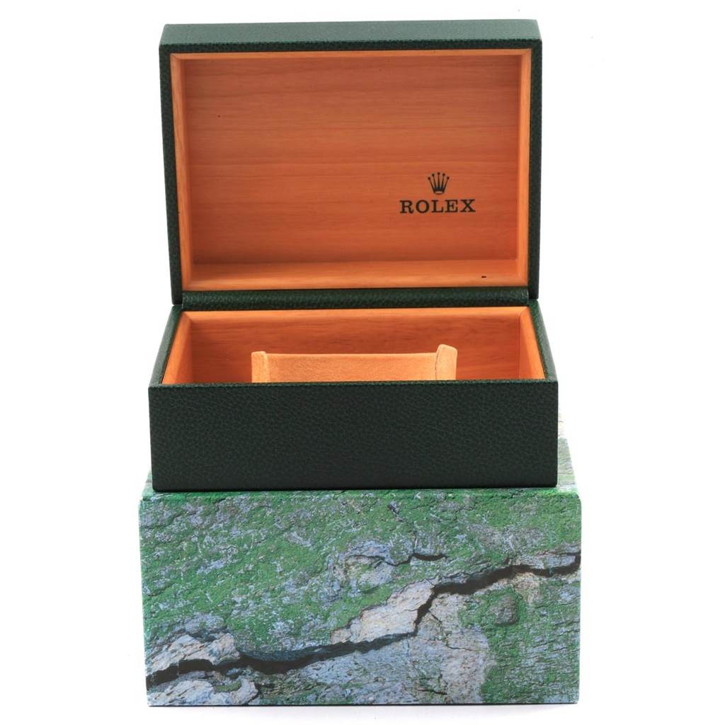 This image shows an open Rolex GMT-Master 20121 Men's Stainless Steel Black Dial 20121 Men's Stainless Steel Black Dial watch box with its interior and exterior visible.