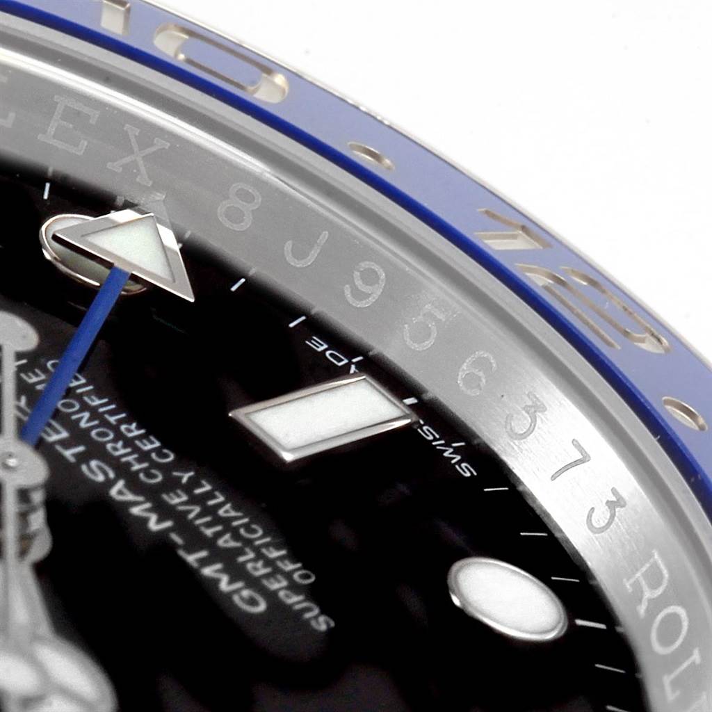 The photo shows a close-up of the dial and bezel of a Rolex GMT-Master 116710 Men's Stainless Steel Black Dial 116710 Men's Stainless Steel Black Dial watch, highlighting the hour markers, hands, and part of the blue bezel.