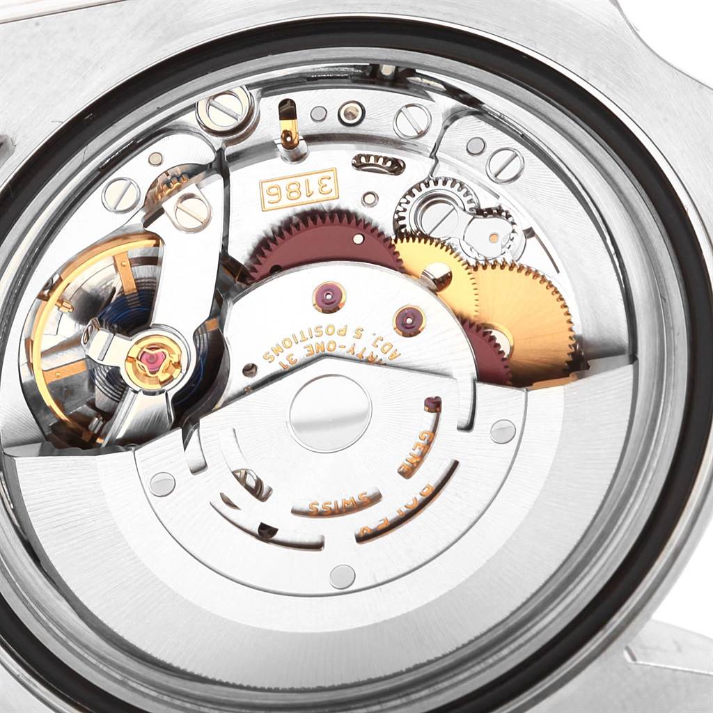 This image shows a close-up view of the internal movement mechanism of a Rolex GMT-Master 116713 Men's Stainless Steel Black Dial 116713 Men's Stainless Steel Black Dial watch, highlighting gears and components.