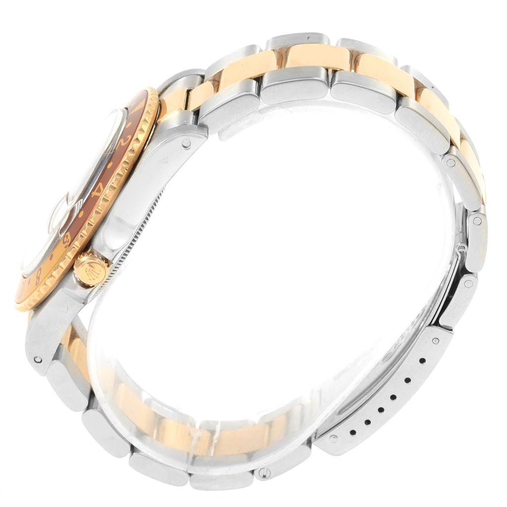 Side view of the Rolex GMT-Master 16753 Men's Stainless Steel Brown Dial 16753 Men's Stainless Steel Brown Dial watch showcasing the bezel, crown, and two-tone bracelet.