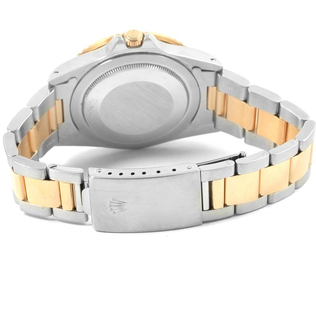 The image shows the back case, crown, and clasp of the Rolex GMT-Master 16753 Men's Stainless Steel Brown Dial 16753 Men's Stainless Steel Brown Dial, focusing on its two-tone metal bracelet.