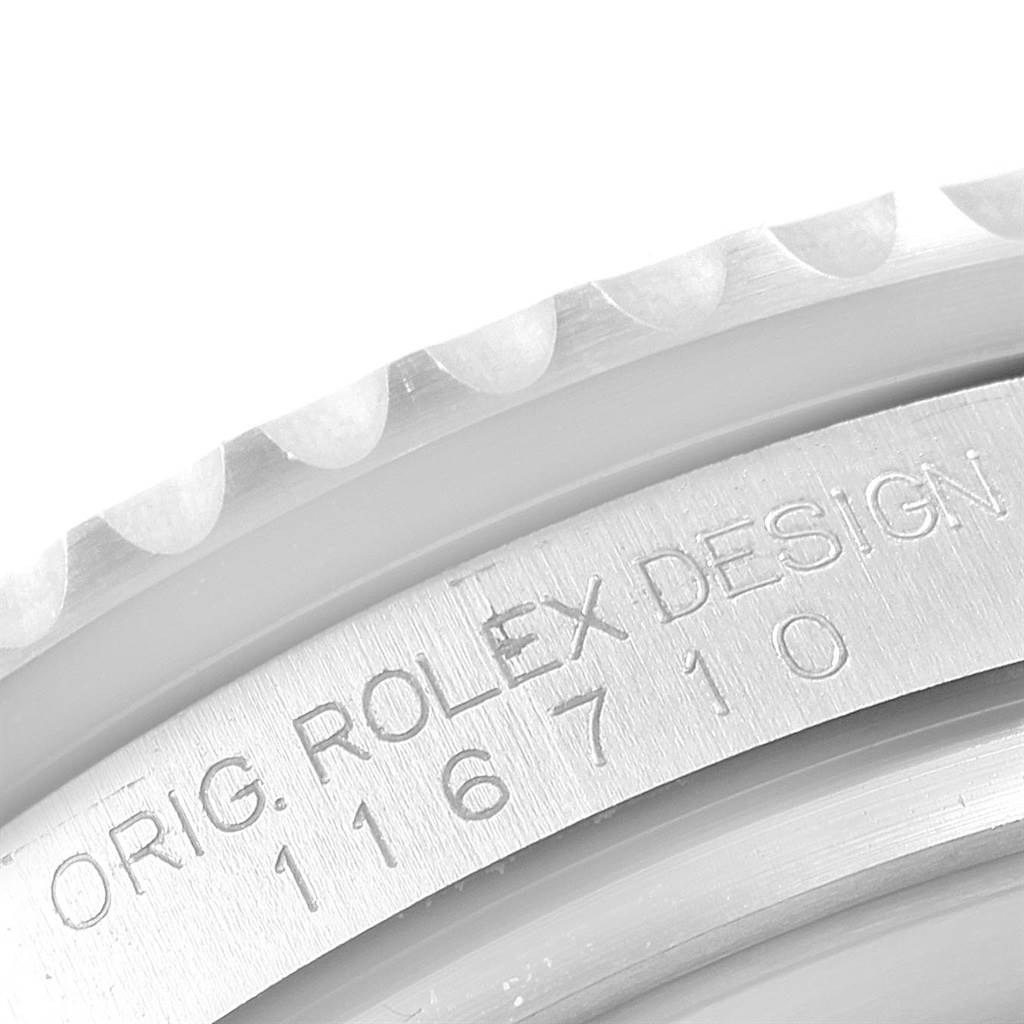 This close-up image shows the engraved inside of the bezel for the Rolex GMT-Master 116710 Men's Stainless Steel Black Dial 116710 Men's Stainless Steel Black Dial, displaying the model number 116710.