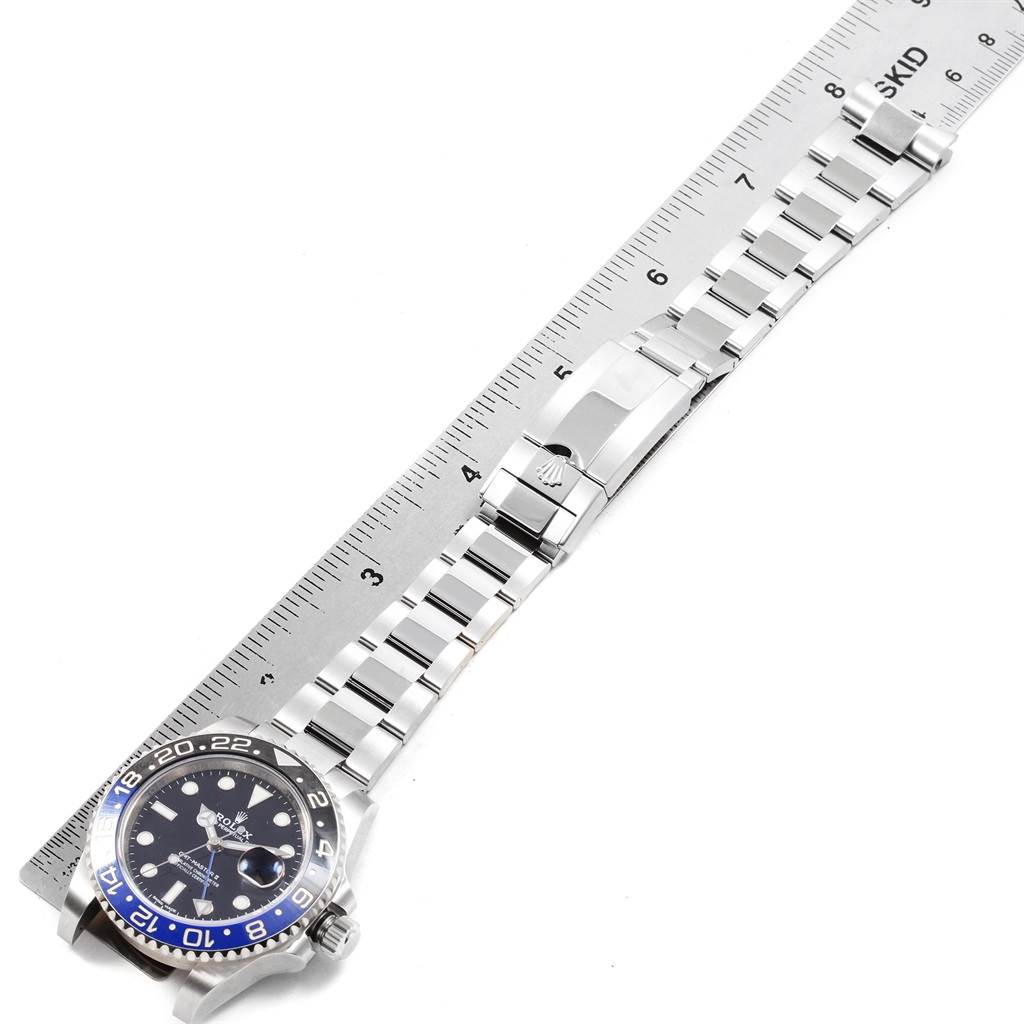 The Rolex GMT-Master 116710 Men's Stainless Steel Black Dial 116710 Men's Stainless Steel Black Dial watch is shown flat with its face, bracelet, and clasp visible, aligned with a ruler.