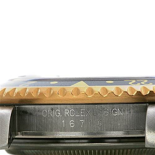 This image shows a side view of a Rolex GMT-Master 16713 Men's Stainless Steel Black Dial 16713 Men's Stainless Steel Black Dial watch, focusing on the case's model number and "ORIG. ROLEX DESIGN" engraving.