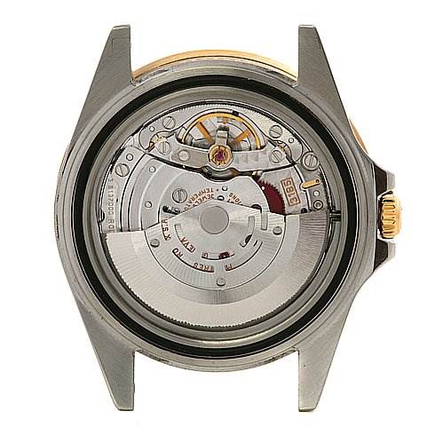 This image shows the backside angle of a Rolex GMT-Master 16713 Men's Stainless Steel Black Dial 16713 Men's Stainless Steel Black Dial watch, displaying its internal mechanical movement.