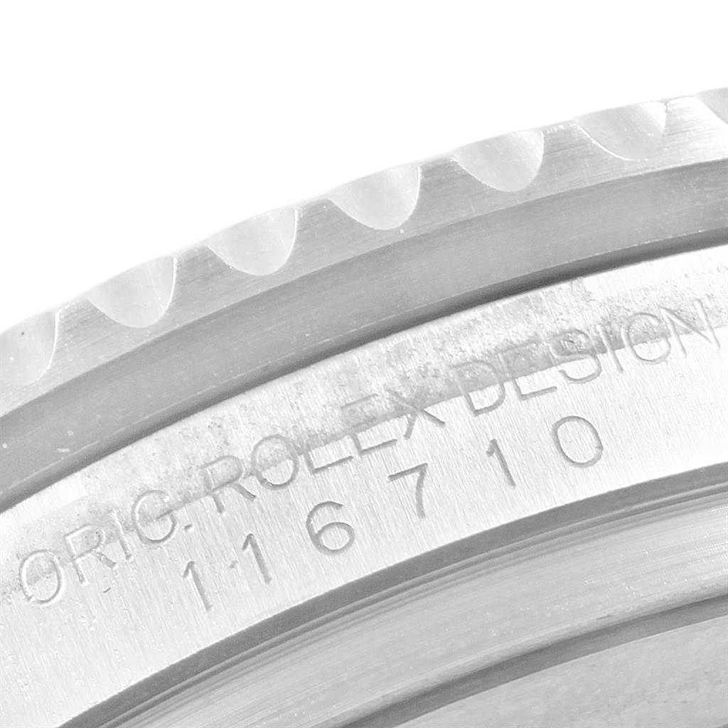 This image shows a close-up of the side profile of a Rolex GMT-Master 116710 Men's Stainless Steel Black Dial 116710 Men's Stainless Steel Black Dial's bezel and case, revealing the model number 116710.