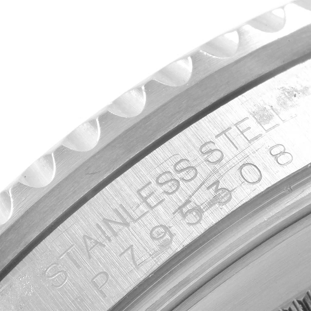 The image shows a close-up of the stainless steel case back and serial number of the Rolex GMT-Master 16710 Men's Stainless Steel Black Dial 16710 Men's Stainless Steel Black Dial watch.