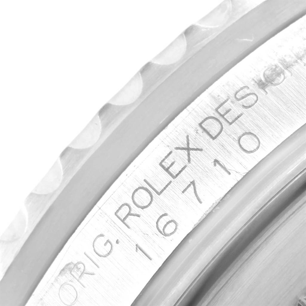 The image shows a close-up view of the side case and inner bezel of a Rolex GMT-Master 16710 Men's Stainless Steel Black Dial 16710 Men's Stainless Steel Black Dial watch, with the model number engraved.