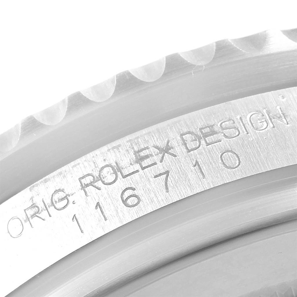 This image shows the edge of the Rolex GMT-Master 116710 Men's Stainless Steel Black Dial 116710 Men's Stainless Steel Black Dial watch case, highlighting the model number 116710 and "ROLEX DESIGN" engravings.