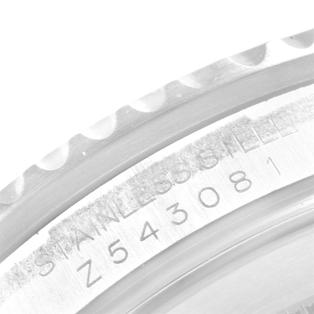 This close-up image shows the engraved serial number and "STAINLESS STEEL" text on the side of the Rolex GMT-Master 16710 Men's Stainless Steel Black Dial 16710 Men's Stainless Steel Black Dial watch case.