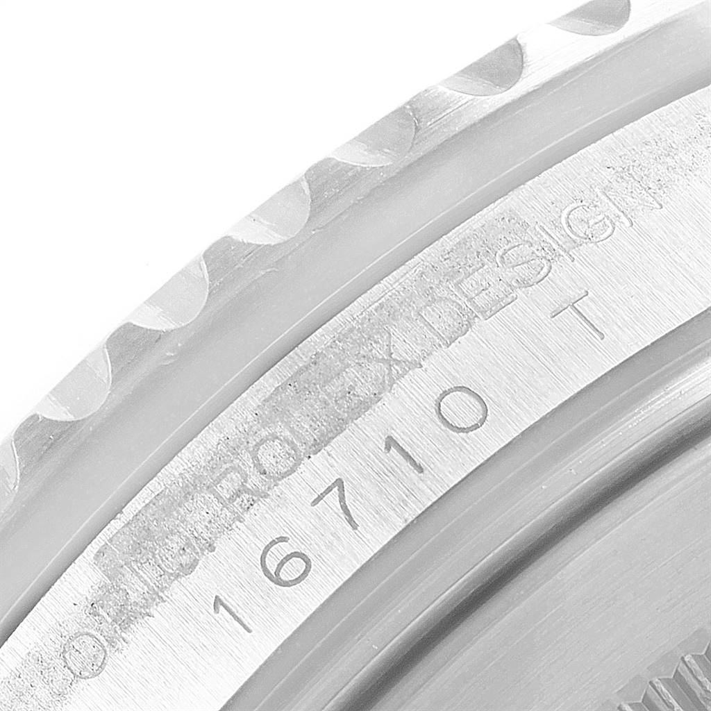 The image shows a close-up of the engraved model number "16710" on the side of a Rolex GMT-Master 16710 Men's Stainless Steel Black Dial 16710 Men's Stainless Steel Black Dial watch case.