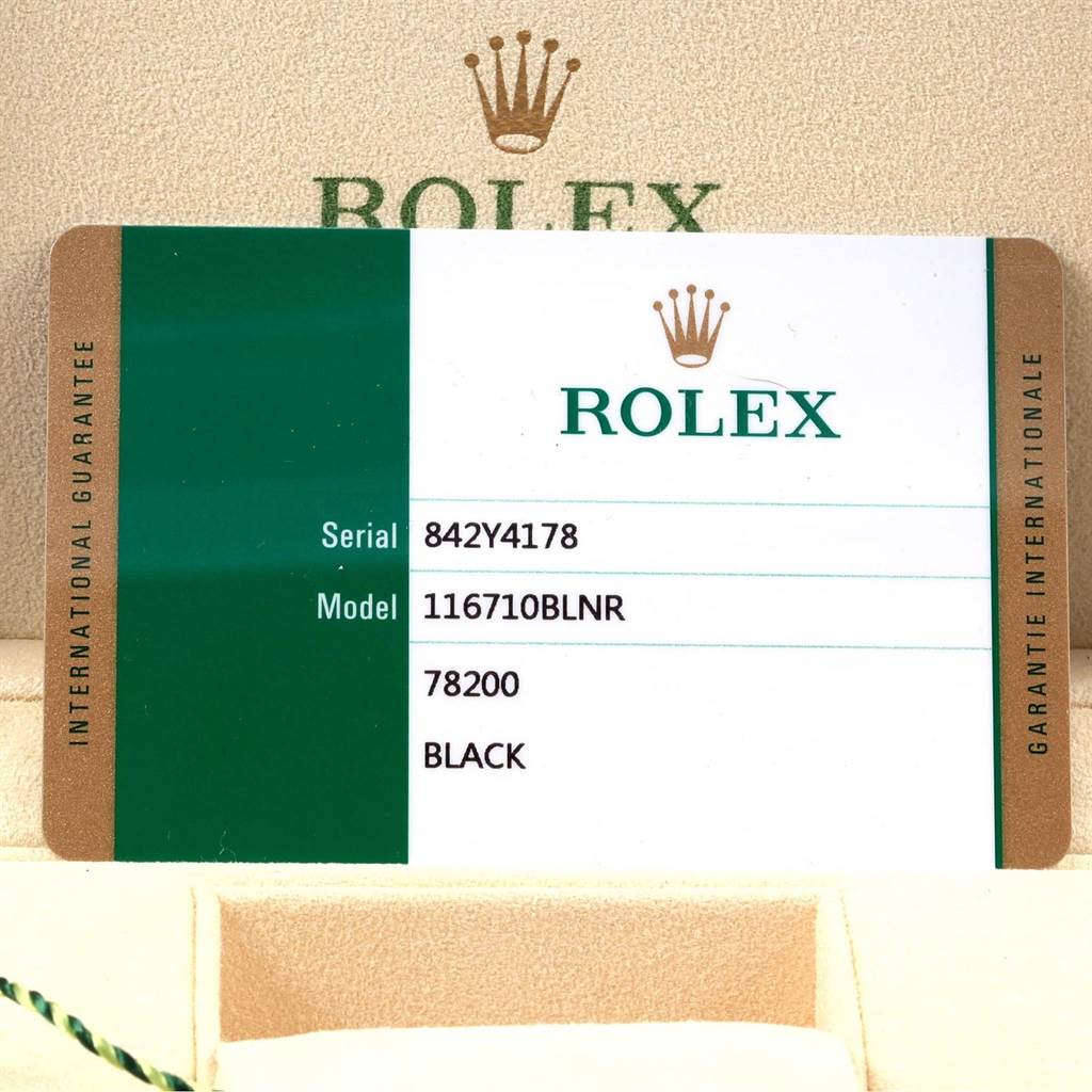 This image shows a warranty card for the Rolex GMT-Master 116710 Men's Stainless Steel Black Dial 116710 Men's Stainless Steel Black Dial model 116710BLNR, displayed in its box.