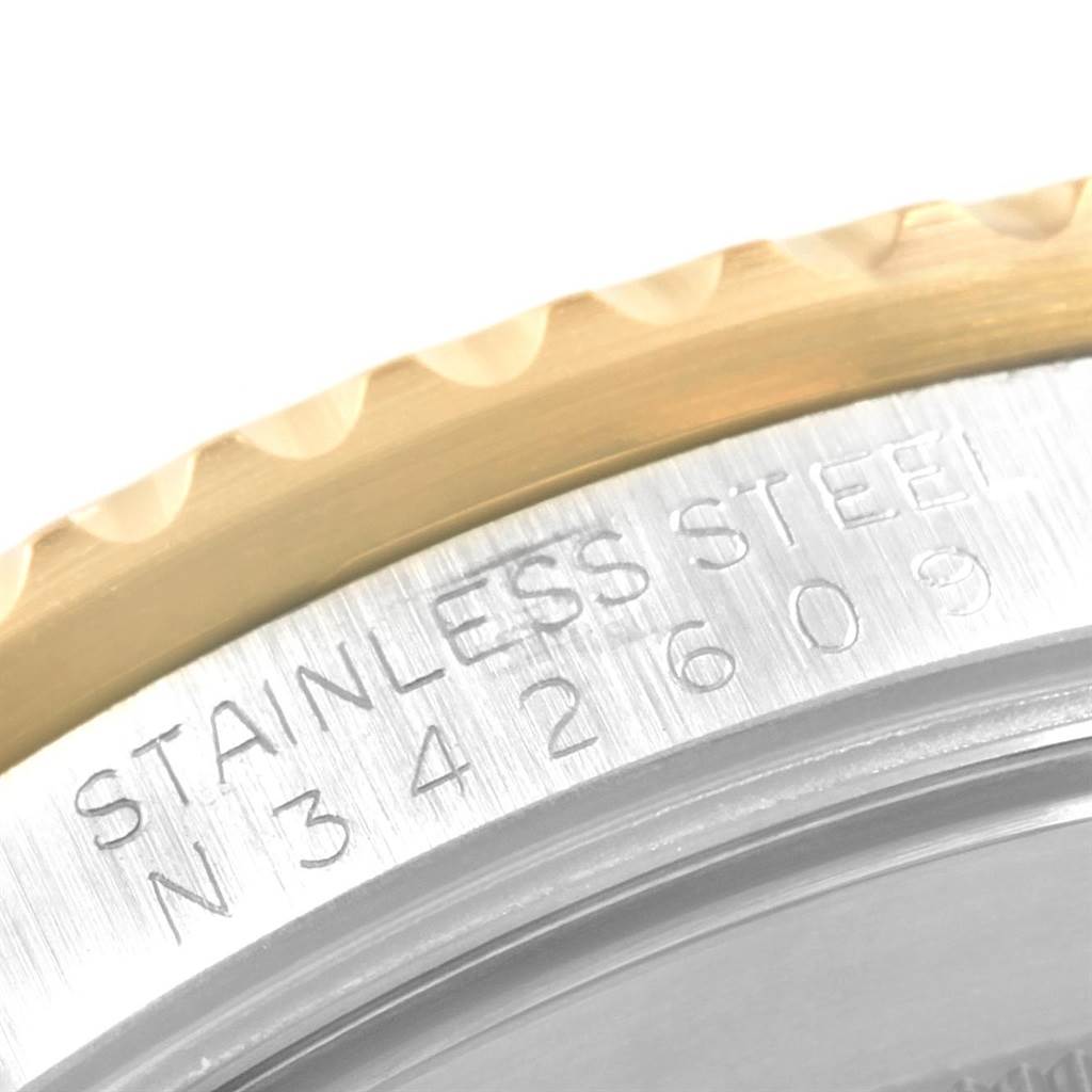 The image shows a close-up angle of the case side and bezel of a Rolex GMT-Master 16713 Men's Stainless Steel Brown Dial 16713 Men's Stainless Steel Brown Dial, featuring the engraved serial and bezel.