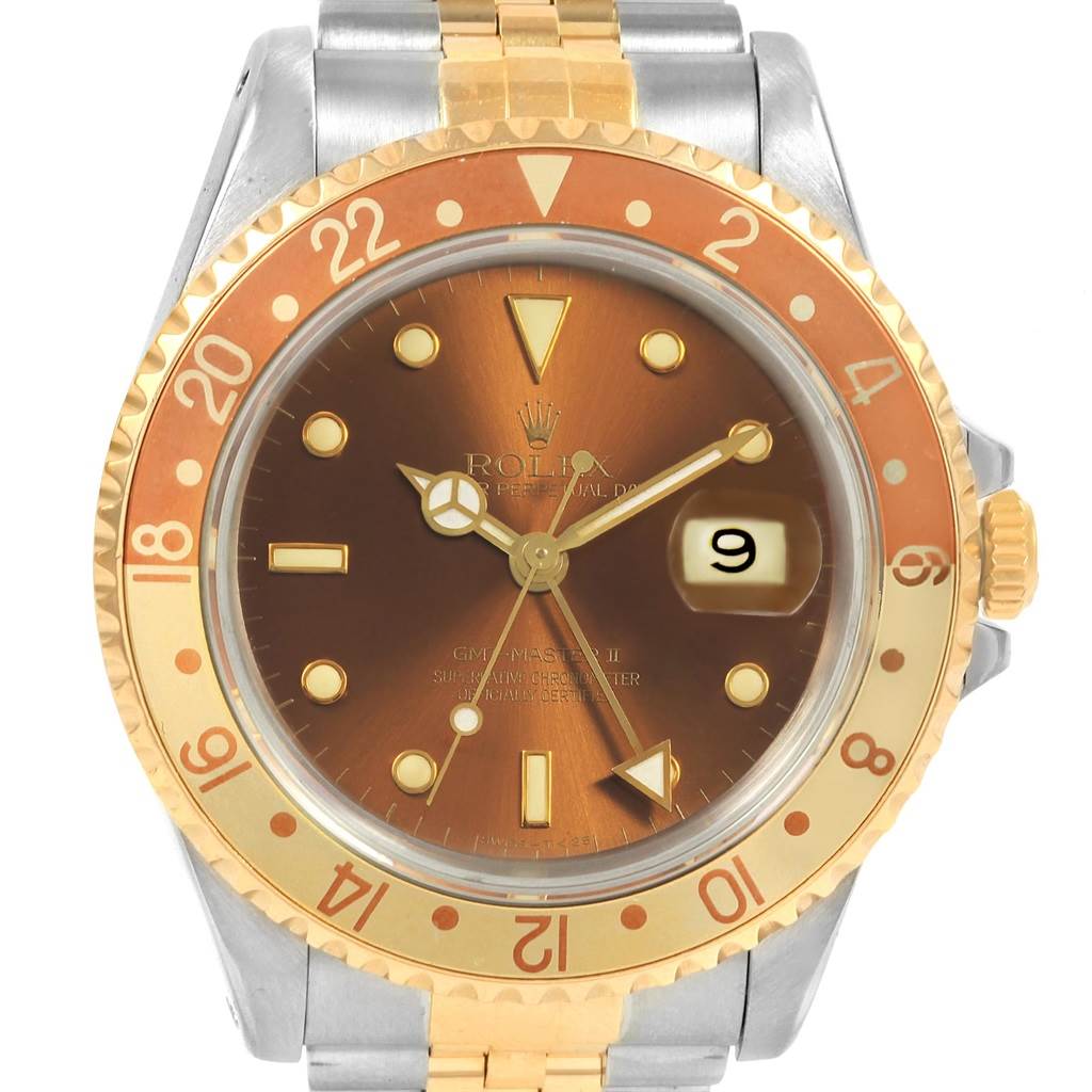 The image shows a front view of the Rolex GMT-Master 16713 Men's Stainless Steel Brown Dial 16713 Men's Stainless Steel Brown Dial watch, highlighting its dial, bezel, crown, and part of the bracelet.