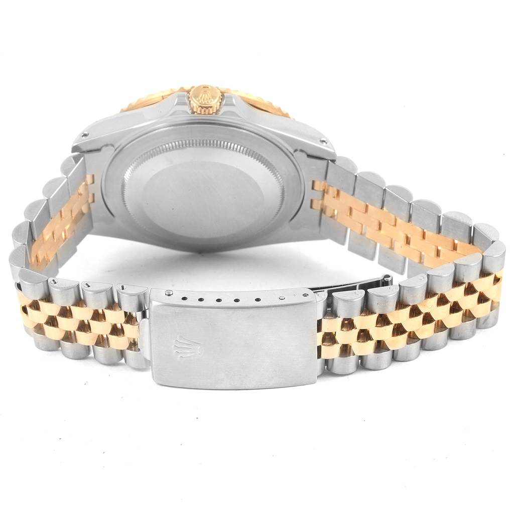 The image shows the back view of a Rolex GMT-Master 16713 Men's Stainless Steel Brown Dial 16713 Men's Stainless Steel Brown Dial watch, highlighting its case, crown, and two-tone bracelet.