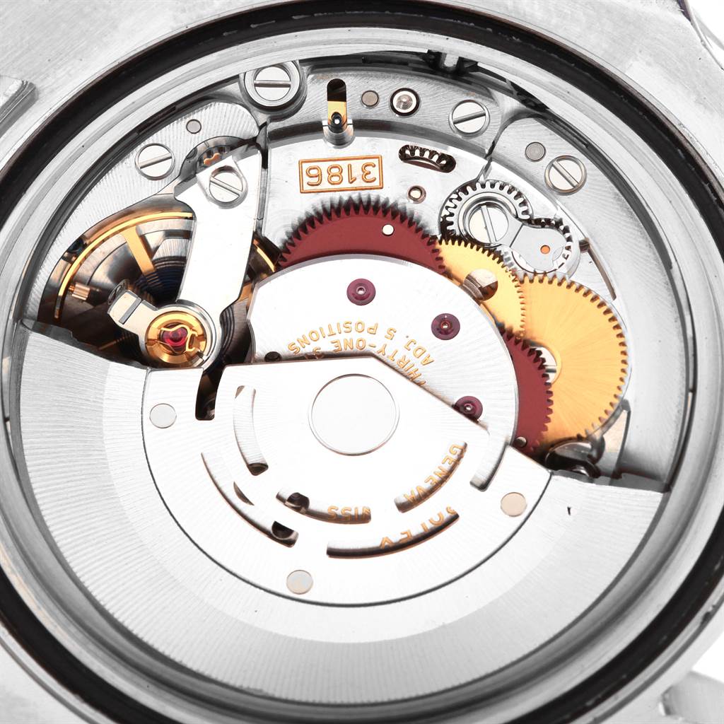 This image shows the intricate inner mechanism and gears of a Rolex GMT-Master 116710 Men's Stainless Steel Black Dial 116710 Men's Stainless Steel Black Dial watch from a close-up rear view.
