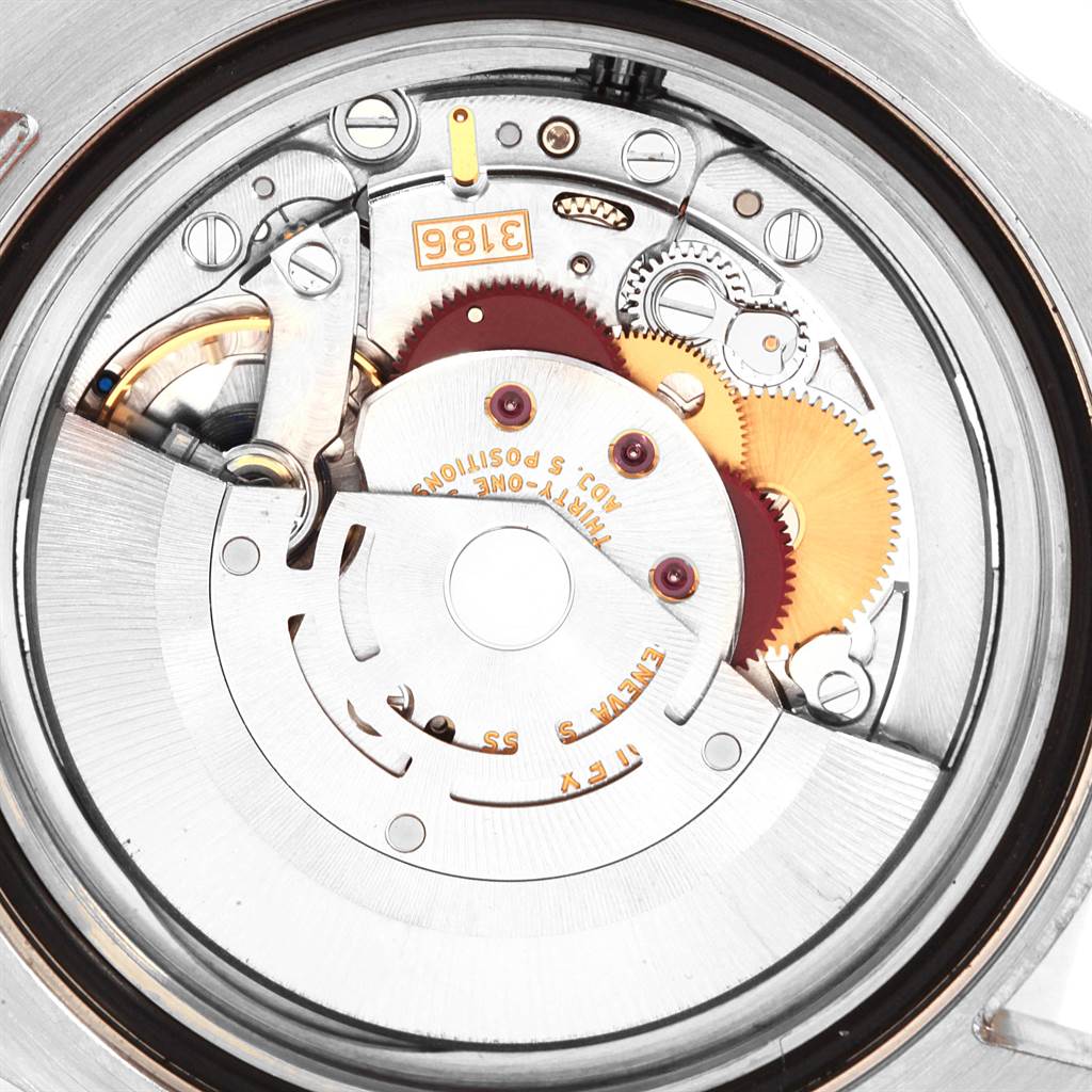 This image shows a close-up of the movement mechanism inside a Rolex GMT-Master 116710 Men's Stainless Steel Black Dial 116710 Men's Stainless Steel Black Dial watch.