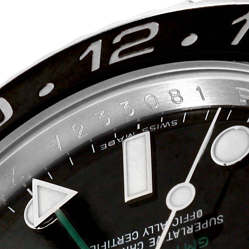The image shows a close-up of the dial, hands, and part of the bezel of a Rolex GMT-Master 116710 Men's Stainless Steel Black Dial 116710 Men's Stainless Steel Black Dial watch.